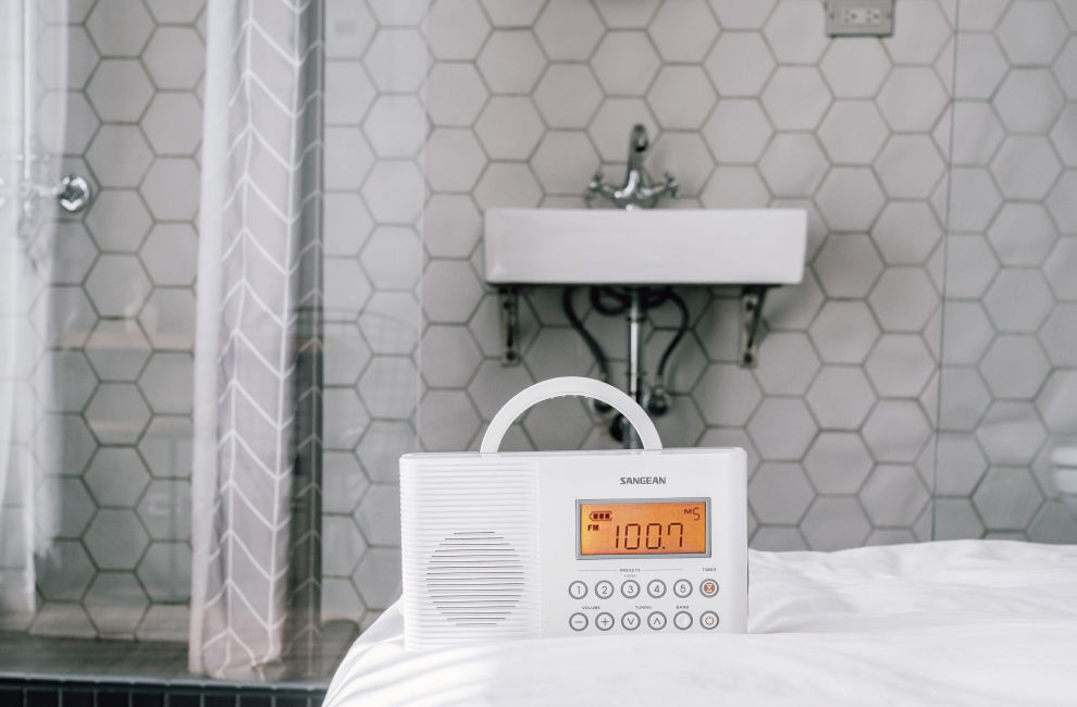 SANGEAN shower radio H201 is on the bed